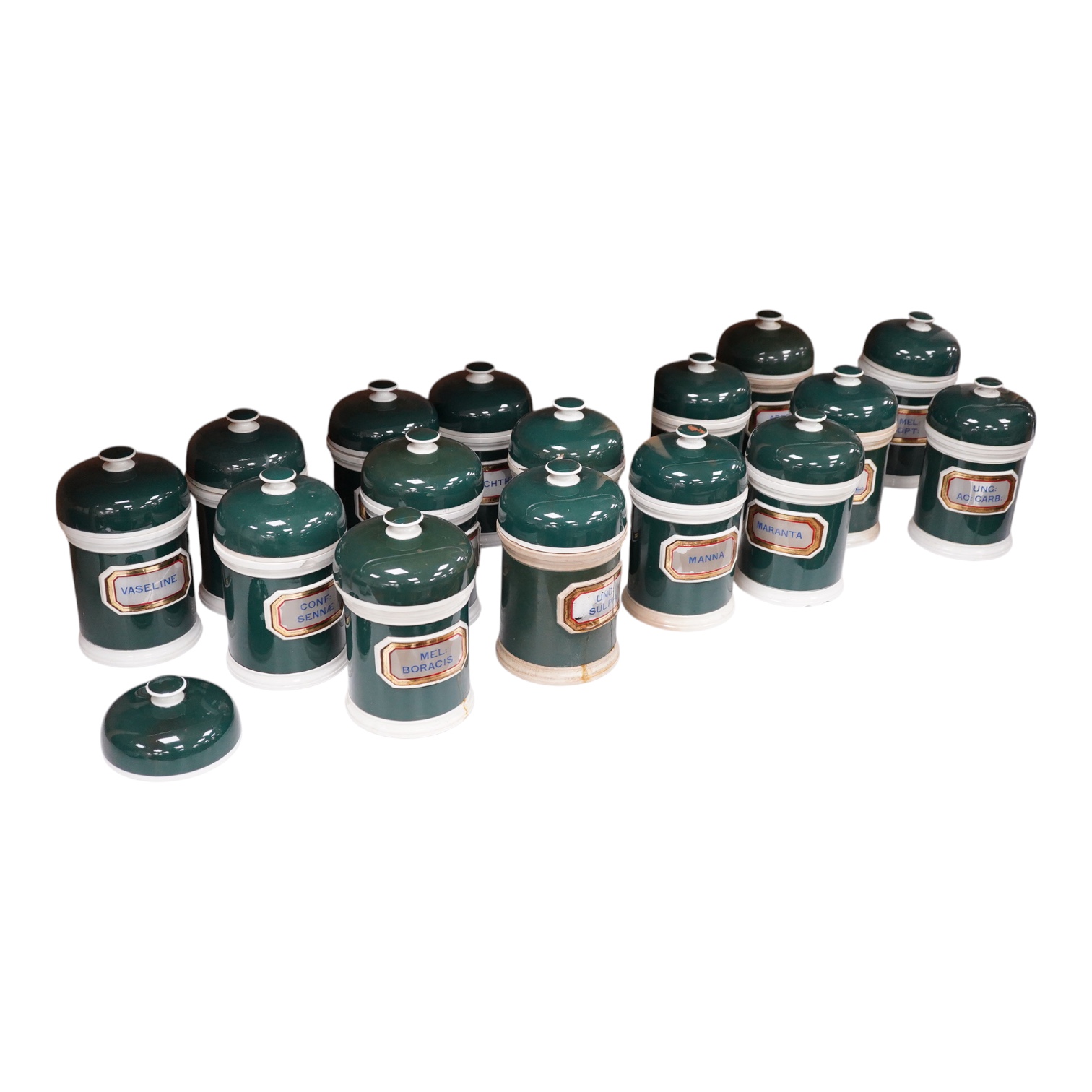 A collection of sixteen 19th/early 20th century ceramic lidded green apothecary jars, with labels painted within panels with raised ceramic edges and gilt lined, examples including; Ung: Zinci, Ung: Sulphur:, Mel: Boraci